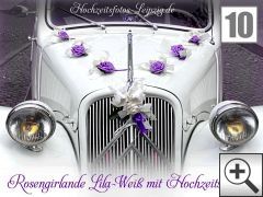 Rosengirlande mit Tauben als Hochzeitsauto Blumenschmuck